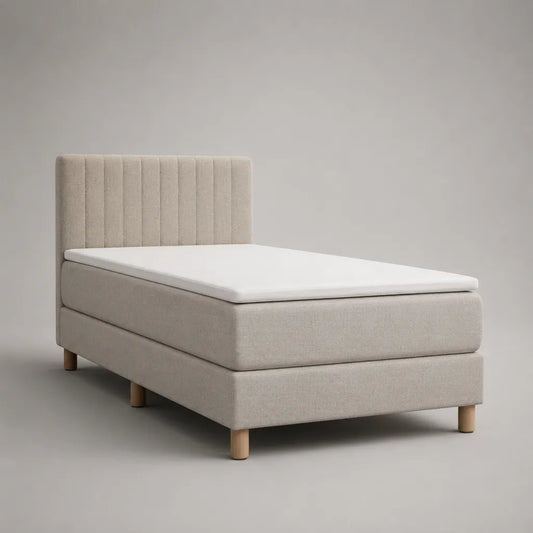 Letto singolo boxspring imbottito in tessuto beige con testiera, materasso e topper, superficie di riposo 90 × 200 cm